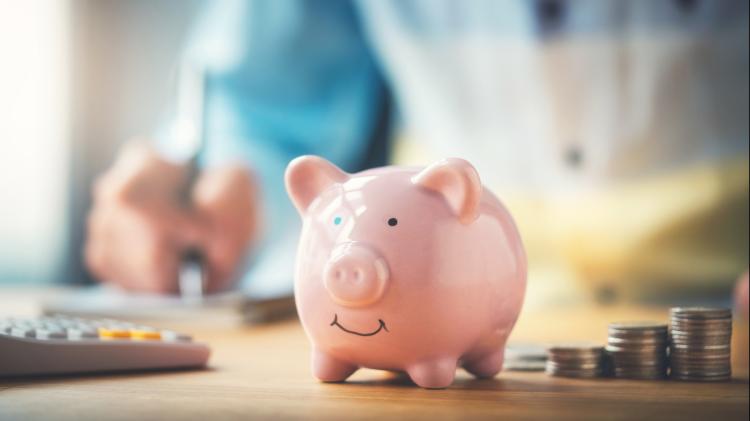 piggy bank on a table with change