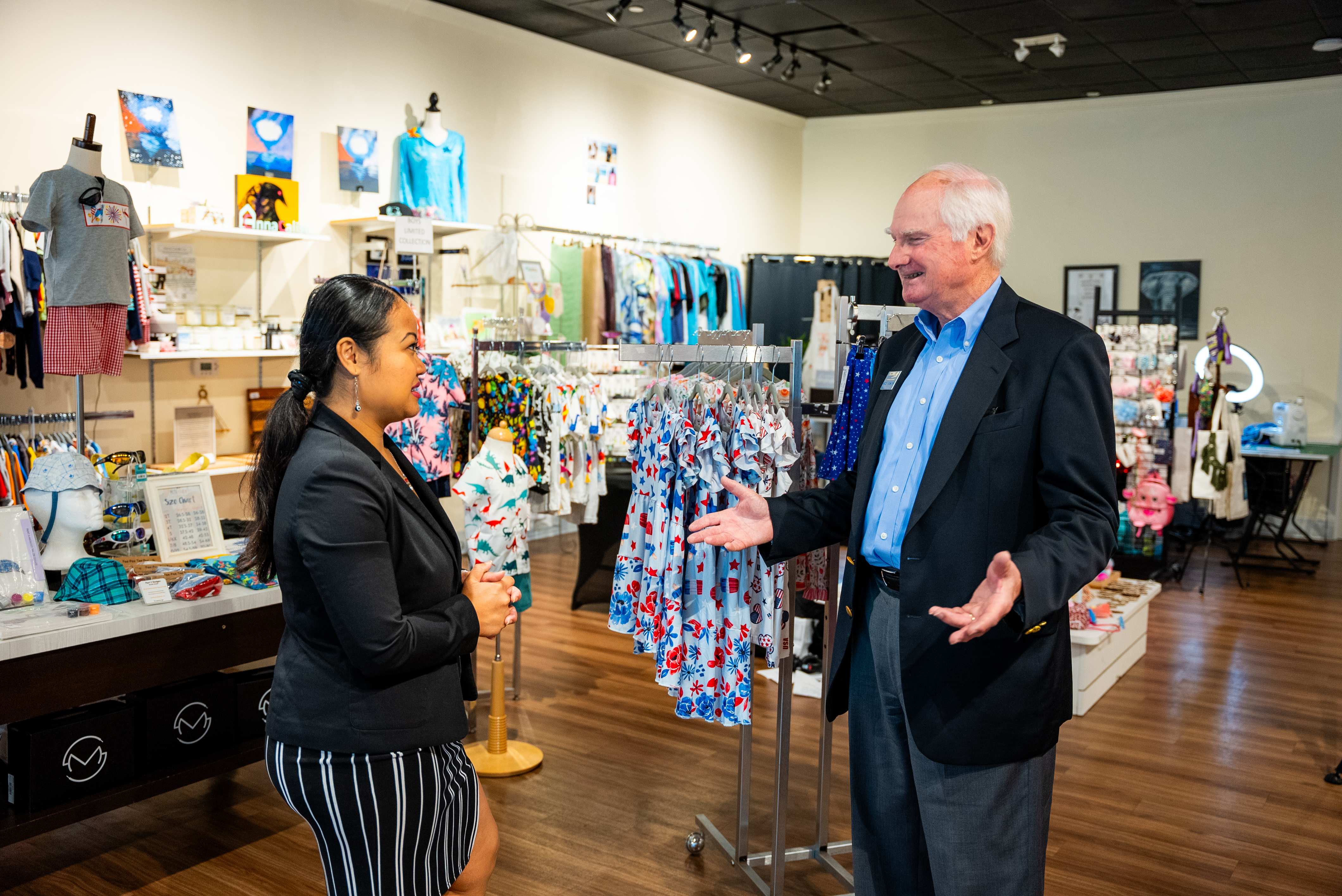 Business owner with her SCORE mentor in her store