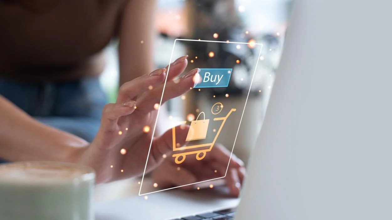 person clicking buy button on computer